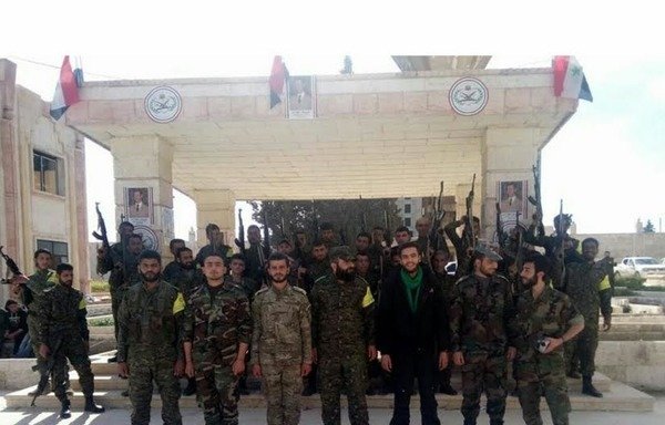 Fighters from the Iran-backed Raad al-Mahdi Regiment pose for a photograph in Syria. [Photo circulated on social media]