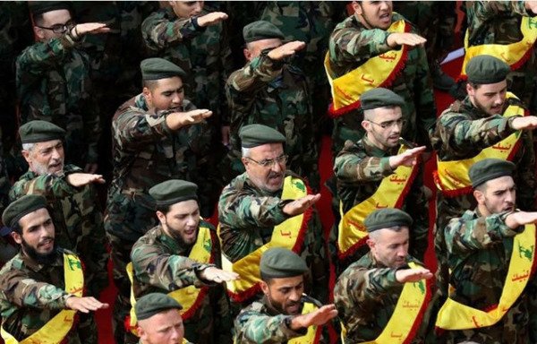 Lebanese men take part in a swearing in ceremony as they join the ranks of IRGC affiliate Hizbullah. [Photo circulated on social media]