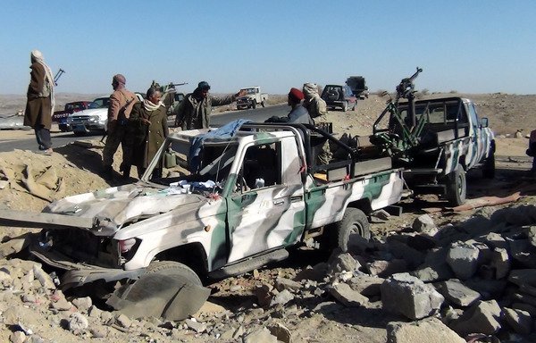 Yemeni soldiers gather at the site of a checkpoint where three policemen were killed in an al-Qaeda suicide attack in al-Bayda province in this file photo from March 13th, 2012. [AFP PHOTO/STR]