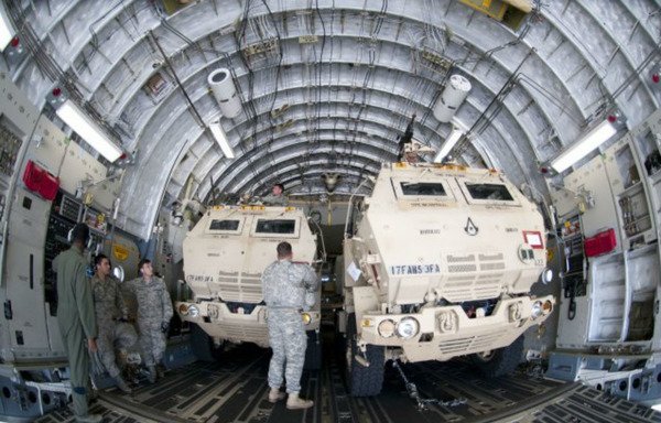 A High-Mobility Artillery Rocket System (HIMARS) is seen being prepared for air transportation. [File]