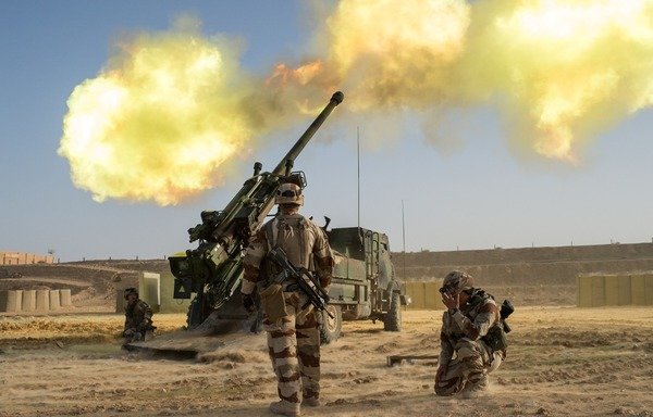 French soldiers fire the CAESAR artillery system, a truck-mounted self-propelled howitzer used in the war in Syria. [Photo courtesy of the French Ministry of Armed Forces]