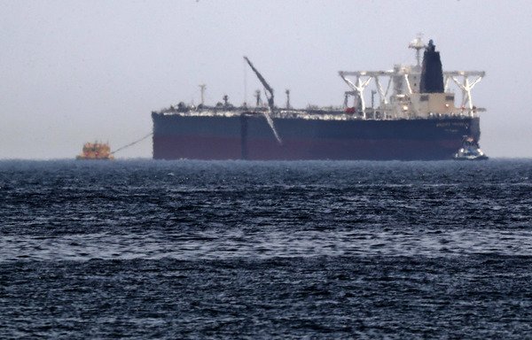 A picture taken on May 13th shows the crude oil tanker, Amjad, one of two reported tankers that were damaged in mysterious 'sabotage attacks', off the coast of the Gulf emirate of Fujairah. [Karim Sahib/AFP]