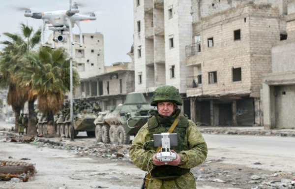 A Russian soldier operates an unmanned aerial vehicle to conduct surveillance in the Syrian city of Aleppo. [Photo circulated on social media]
