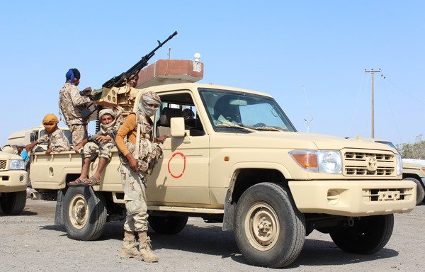 Forces loyal to the Yemeni government stand guard on a road at the entrance to Abyan province as they take part in an operation to drive al-Qaeda out of the southern provincial capital on April 23rd, 2016. [Saleh al-Obeidi/AFP]