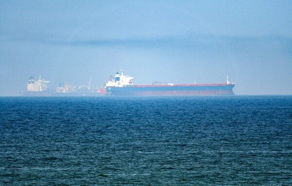 This picture taken on June 15th shows tanker ships in the waters of the Gulf of Oman off the coast of the eastern UAE emirate of Fujairah. [Giuseppe Cacace/AFP]