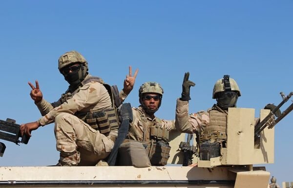 Iraqi soldiers flash the victory sign on July 11th during the 'Will of Victory' campaign to clear Anbar's western desert of ISIS remnants. [Photo courtesy of the Iraqi Ministry of Defence] 
