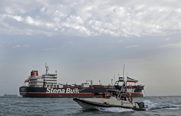 A picture taken on July 21st shows the IRGC patrolling around the British-flagged tanker Stena Impero as it is anchored off the Iranian port city of Bandar Abbas. [Hasan Shirvani/MIZAN NEWS AGENCY/AFP]