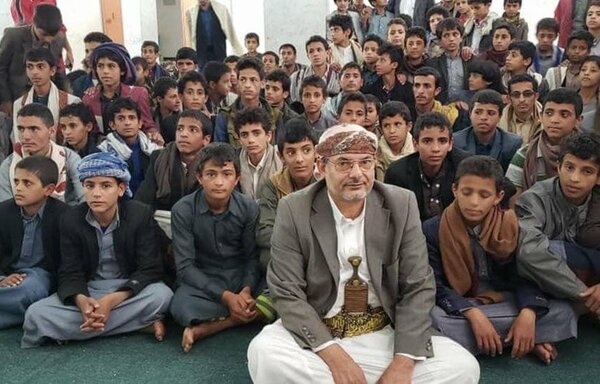 The Houthis 'Minister of Education', Yahya al-Houthi, who is the brother of Houthi leader Abdul Malik al-Houthi, sits in the front row at a summer camp in Sanaa. [Photo courtesy of Ali al-Bukhaiti's Twitter page]