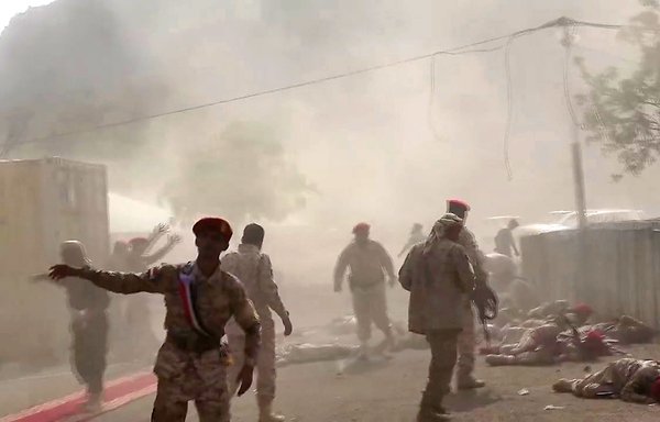 This AFPTV screenshot from a video made on Thursday (August 1st) shows Yemeni security forces at the scene of a deadly Houthi missile attack on a military camp west of Aden. [Nabil Hasan/AFP]