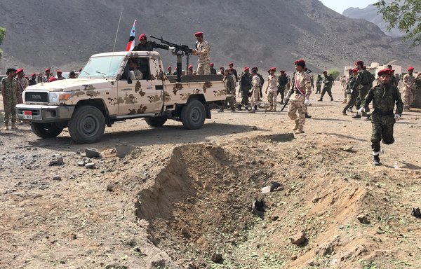 Yemeni forces rush to the scene of a missile attack on a military camp west of Aden on Thursday (August 1st). Dozens of Yemeni police, including a senior commander, were killed or wounded in the attack. [Nabil Hasan/AFP]