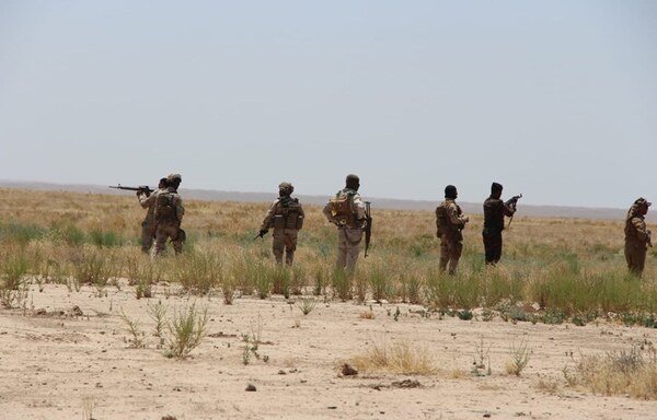 Iraqi soldiers are deployed to the western Anbar desert to track down ISIS remnants and hideouts as part of the first phase of the 'Will of Victory' campaign. [Photo courtesy of the Iraqi Defence Ministry]