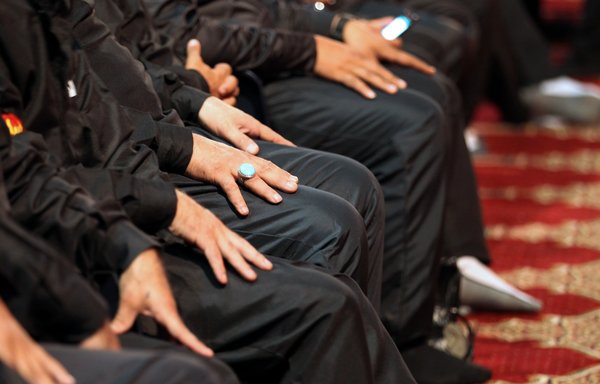 A close up shot shows the hands of Lebanese Shia as they gather a day ahead of the Ashura rituals in the Sayyed al-Shuhadaa complex in a southern suburb of Beirut on October 1st, 2016. [Anwar Amro/AFP]