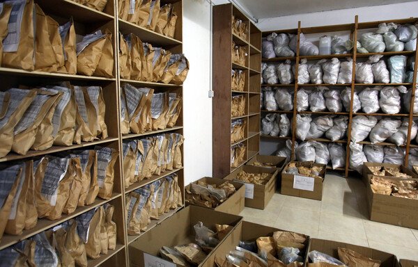 Bags containing confiscated drugs are displayed at the police anti-narcotics unit headquarters in Amman on January 7th. [Khalil Mazraawi/AFP] 