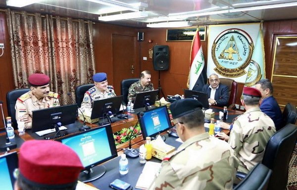 Iraqi Prime Minister Adel Abdul Mahdi and military leaders discuss the progress of the fourth phase of the 'Will of Victory' campaign on August 25th. [Photo courtesy of the Prime Minister's Office]