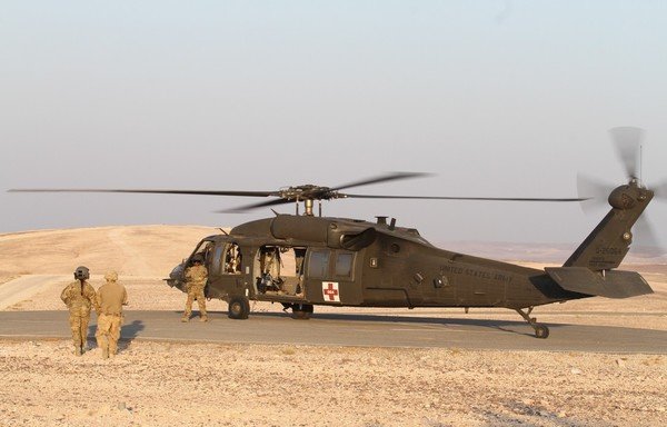 Members of the medical evacuation platoon with the US Army Reserve’s 5th Battalion, 159th Aviation Regiment prepare to load a simulated casualty as part of medevac training on August 24th in Jordan during preparations for Exercise Eager Lion 19. [Photo courtesy of US CENTCOM] 