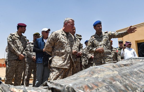 US Marine Corps Gen. Kenneth F. McKenzie Jr., commander of the US Central Command, and Lt. Gen. Fahd bin Turki bin Abdulaziz al-Saud, commander of the Saudi-led Arab coalition forces in Yemen, are shown by coalition spokesman Col. Turki al-Maliki reportedly Iranian weapons seized by Saudi forces from Yemen's Houthis, during a visit to a military base in al-Kharj in central Saudi Arabia on July 18th. [Fayez Nureldine/AFP]