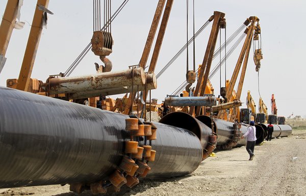 Iranians work on a section of a gas pipeline linking Iran and Pakistan on March 11th, 2013. Recent reports indicate Iran would like to establish a similar pipeline between Iran and Syria, but Iraqi officials and analysts say the Iraqi government will not allow this idea to come to fruition. [Atta Kenare/AFP] 