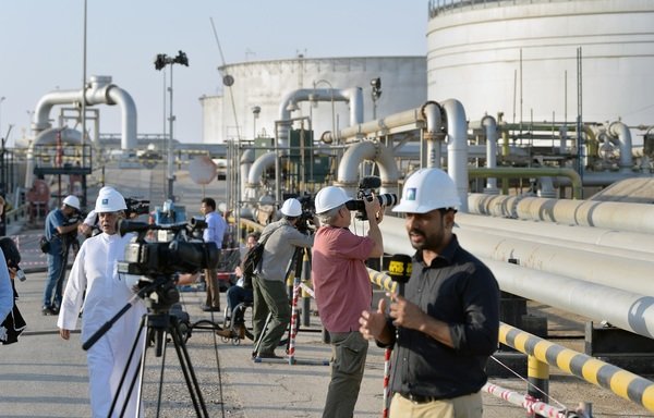 Media professionals view the damage to a Saudi Aramco oil facility caused by a September 14th attack. [Photo courtesy of Saudi Press Agency] 