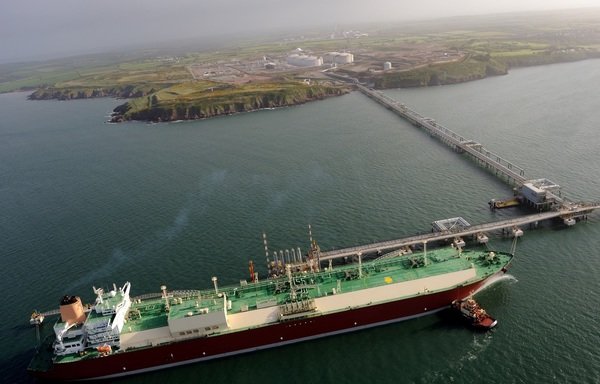 A giant gas tanker is loaded at a Qatari gas refinery in the Gulf where the largest natural gas field in the world is shared between Qatar and Iran. [Photo courtesy of Qatargas website]