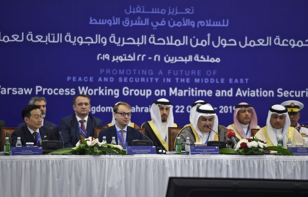 Bahraini Foreign Minister Sheikh Khalid Bin Ahmed Al Khalifa delivers opening remarks at the start of the Ministerial Maritime and Aviation Security Working Group meeting in Manama on October 21st, flanked by Poland’s deputy Interior Minister Krzysztof Kozlowski and the representative of the US State Department Eliot Kang. [STR/AFP]
