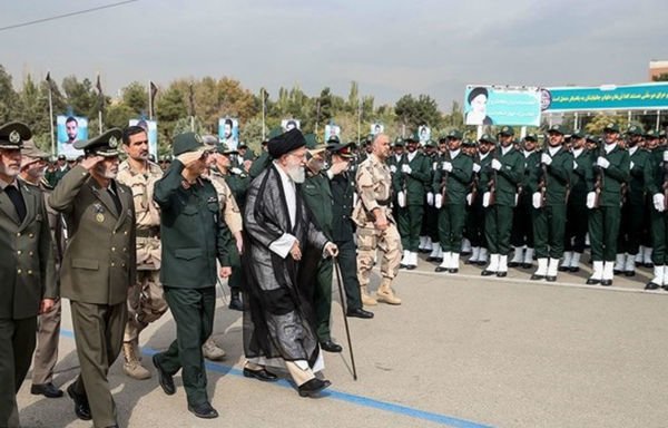 Iran's Supreme Leader Ali Khamenei is seen with IRGC officers at a ceremony in Tehran. [Photo via Fars News Agency]