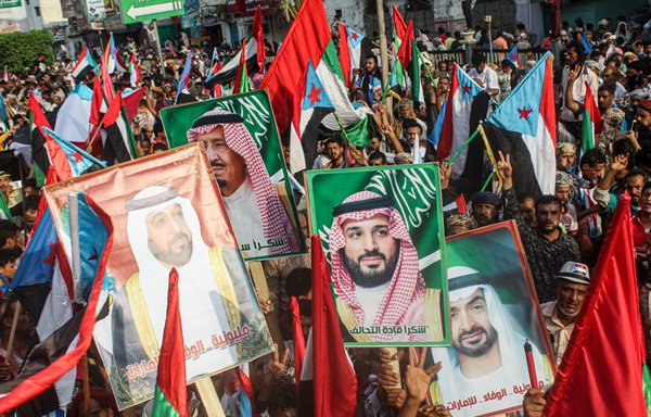 People march with the flags of south Yemen, the UAE, and Saudi Arabia, as portraits are raised of Saudi King Salman bin Abdulaziz, his son Crown Prince Mohammed bin Salman, UAE President Khalifa bin Zayed Al Nahyan, and his brother Abu Dhabi Crown Prince Mohammed bin Zayed Al Nahyan, during a demonstration titled the "million-man march of gratitude for Saudi Arabia and the UAE", in the centre of the Yemeni city of Aden on September 5th. [Saleh al-Obeidi/AFP]