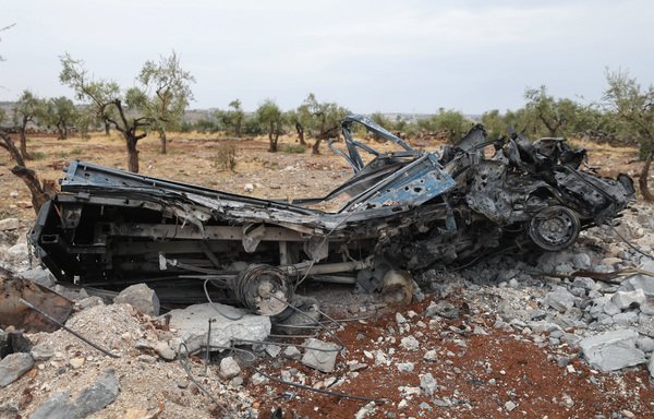 A picture taken October 28th shows a vehicle wreck amid the rubble at the site of a US special forces raid on ISIS chief Abu Bakr al-Baghdadi's hideout in the Syrian village of Barisha in Idlib province. [Omar Haj Kadour/AFP]