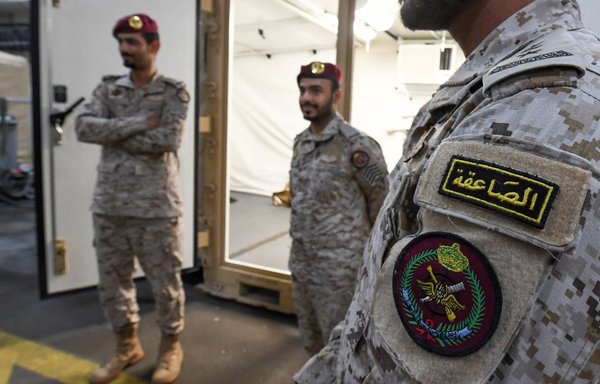 Members of the Saudi special forces stand aboard Britain's RFA Cardigan Bay landing ship in the Gulf waters off Bahrain during the International Maritime Exercise (IMX), on November 5th. [Karim Sahib/AFP]
