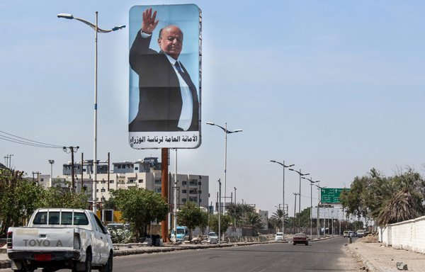 This picture taken on November 6th shows a billboard bearing a portrait of Yemen's President Abd Rabbu Mansour Hadi on a main road in the Red Sea port city of Aden. [Saleh al-Obeidi/AFP]