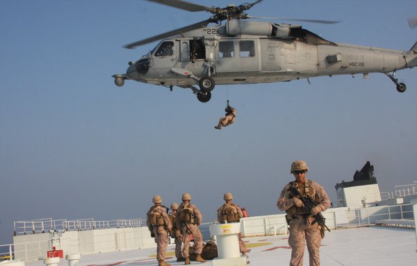 Marines assigned to Fleet Anti-Terrorism Security Team, Central Command (FASTCENT) prepare to be extracted from a US-flagged merchant vessel, after providing security during a Strait of Hormuz transit October 21st. [US CENTCOM]