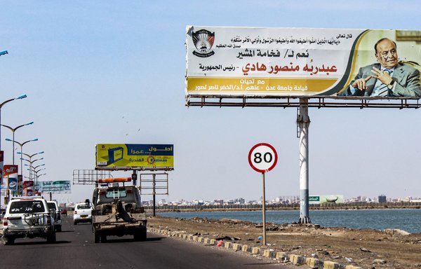 A billboard bearing a portrait of Yemeni President Abd Rabbu Mansour Hadi is displayed on a main road in the port city of Aden on November 6th. [Saleh al-Obeidi/AFP]