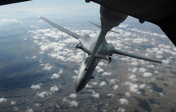A B-1B strategic bomber refuels in mid-air at high altitude. [Photo courtesy of military.com]