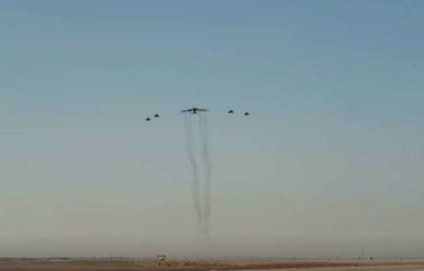 A US Air Force B-52H Stratofortress, accompanied by four Saudi Arabian F-15C Eagles, conducts a low pass over Prince Sultan Air Base, Saudi Arabia, on November 1st. [Photo courtesy of the US Air Force Central Command]
