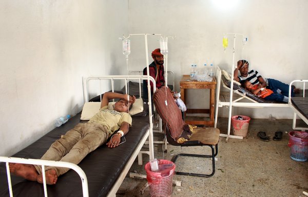 Yemenis displaced from an area near the Saudi border and believed to be suffering from dengue fever rest in the clinic of a makeshift camp in the country's northern Hajjah province, on October 19th. [Essa Ahmed/AFP]