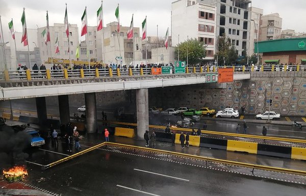 Iranian protestors block a road during a demonstration against an increase in gasoline prices in Tehran, on November 16th. [AFP]