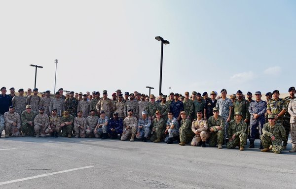 Officers and participants in the International Maritime Exercise 2019 (IMX 19) pose for a photograph. [Photo courtesy of the Saudi Ministry of Defence]