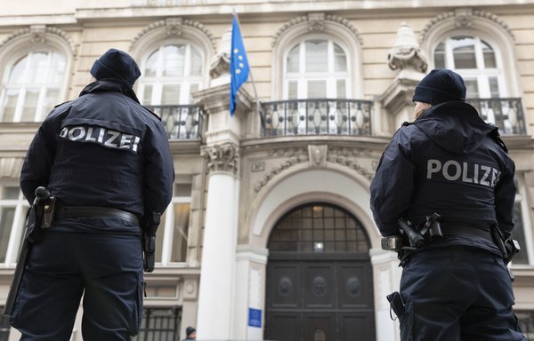 Austrian policemen stand on guard outside the EU Delegation to the International Organisations office during the meeting of the Joint Commission on Iran's nuclear programme in Vienna, Austria, on December 6th. [Joe Klamar/AFP]
