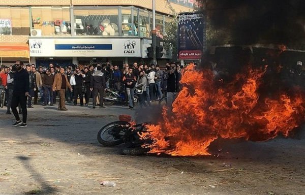 Iranian demonstrators set ablaze two motorcycles that belong to security forces. [Photo via Fars News]