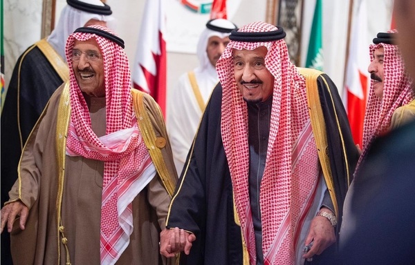 Saudi Arabia's monarch and Kuwait's emir head to the conference hall to commence the work of the 40th Gulf Summit. [Photo courtesy of Saudi Press Agency]