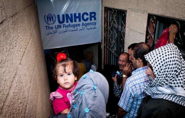 Refugees wait outside the UNHCR office in the Bekaa valley in Lebanon to receive aid. [Photo courtesy of the UNHCR]