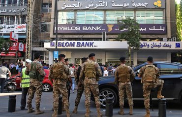 Lebanon ups security at protest sites after violence