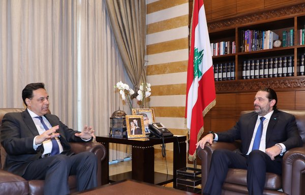 Lebanese outgoing prime minister Saad al-Hariri meets with Prime Minister-designate Hassan Diab in Beirut on December 20th. [AFP]