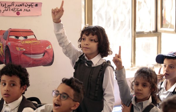 Yemeni girls and boys attend class at the start of the new academic year in Sanaa, on September 16th. [Mohammed Huwais/AFP]