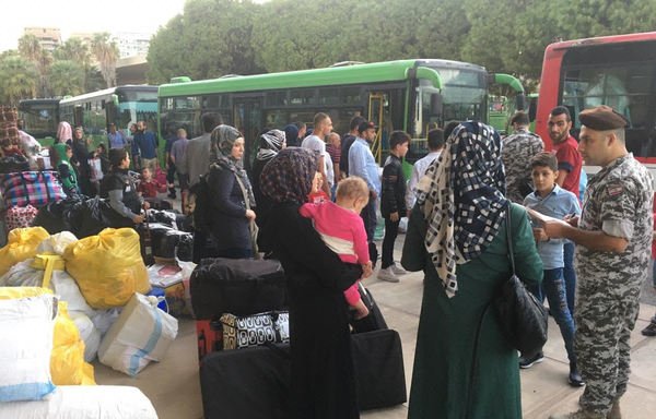 Syrian refugees prepare to return to their homeland with assistance from Lebanon's General Directorate of General Security. [Photo courtesy of GDGS]
