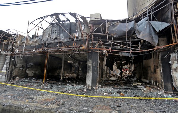 Shops destroyed during demonstrations against petrol price hikes are pictured on November 20th in Shahriar, west of Tehran. [Atta Kenare/AFP]