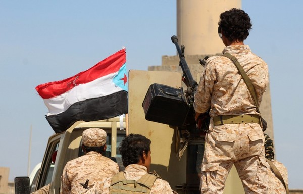 Fighters with Yemen's Security Belt Force are seen in a reinforcements convoy heading from the southern city of Aden to Abyan province on November 26th, 2019. [Saleh al-Obeidi/AFP]