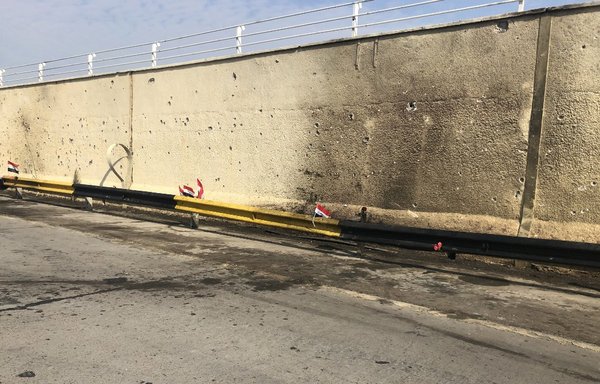 A picture taken on January 4th shows the site where top Iranian commander Qassem Soleimani and Iraqi paramilitary chief Abu Mahdi al-Muhandis were killed along with eight others in a US strike the day before, outside the international airport road in the capital Baghdad. [Ali Choukeir/AFP]