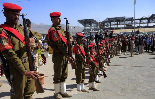 Members of the Iran-backed Houthi military police parade in the streets of Sanaa on January 8th during 'martyrs' week. [Mohammed Huwais/AFP]
