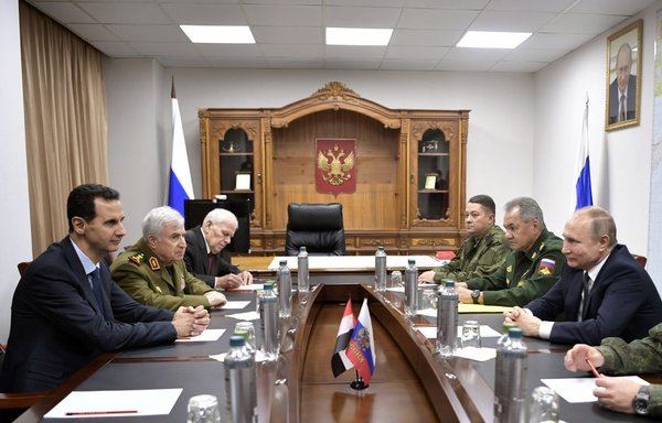 Russian President Vladimir Putin and Syrian President Bashar al-Assad hold a meeting at the headquarters of the Russian forces in the Syrian capital Damascus on January 7th, 2020. [Alexey Nikolsky/Sputnik/AFP]