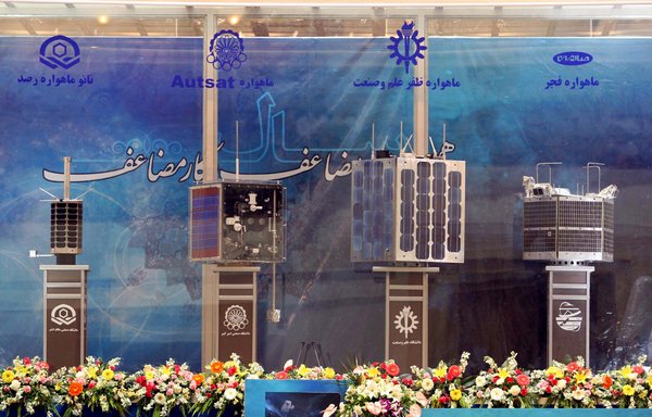 Iran's prototypes of four home-built satellites: Rasad, Amir Kabir-1, Zafar and Fajr, are on display during their unveiling ceremony in Tehran in this file photo from February 7th, 2011. [Vahid Reza Alaei/AFP]